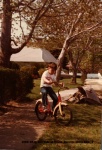 1980-05 Grand Kids at Moms, Darren riding bike_1.jpg