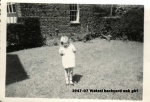 1947-07 Watzel backyard unk girl.jpg