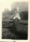 1957-Meg mowing the lawn, summer .jpg
