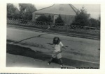1959-Summer Meg in front of house.jpg